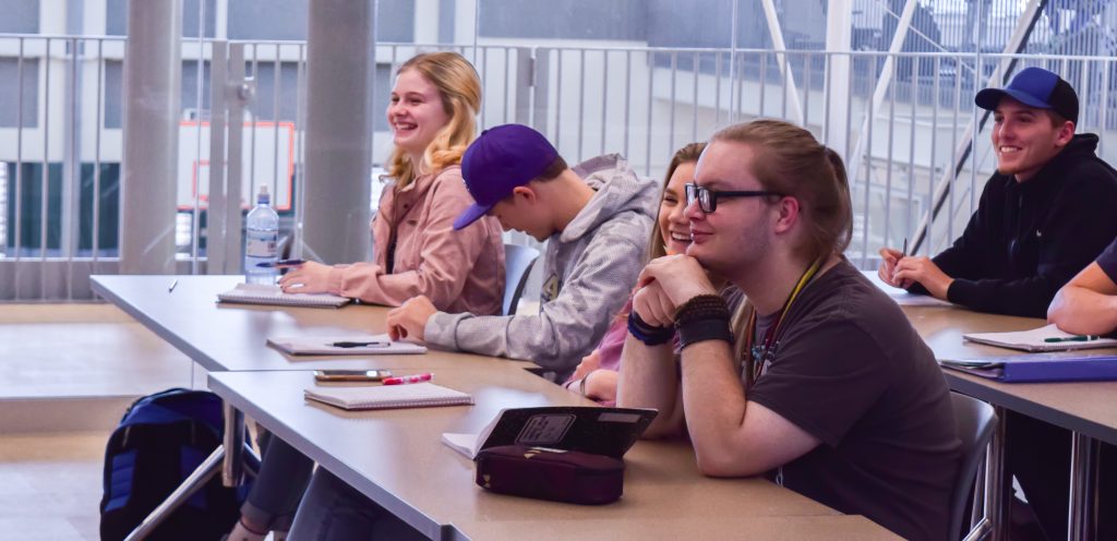 Students at tables in classroom