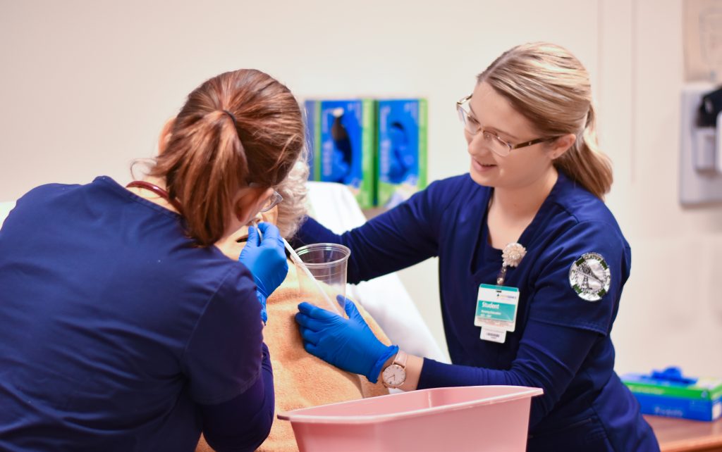 Nursing students practice on their skills in the nursling labs at CCC