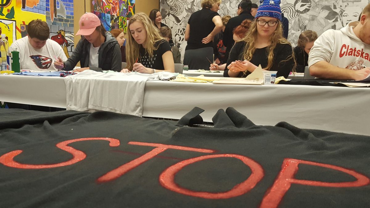 Students paint shirts to bring awareness to domestic violence