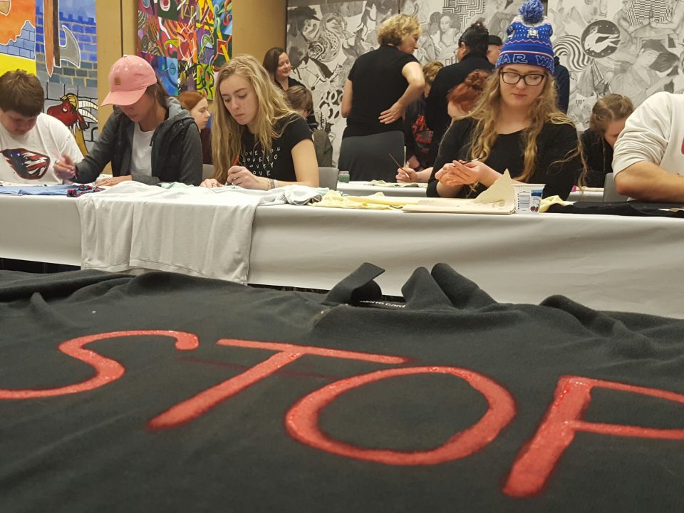 Students paint shirts to bring awareness to domestic violence
