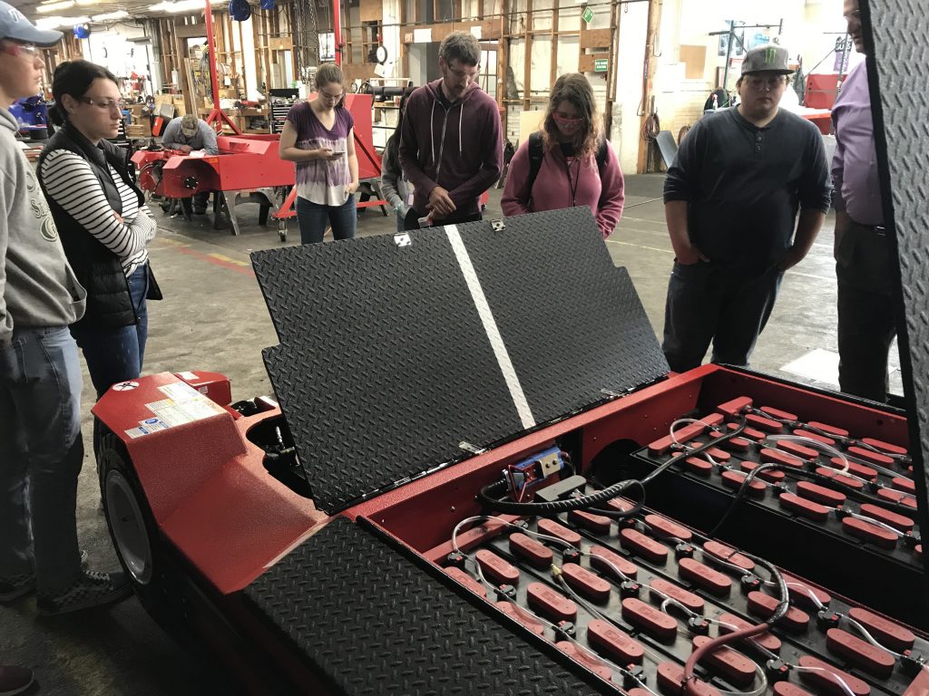 Upward Bound students explore alternative energy at Lectro while looking at the electric plane tugs