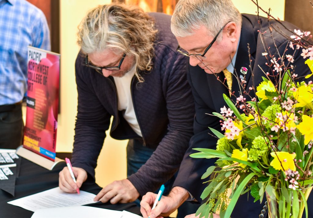 CCC President Breitmeyer and PNCA Interim President Maples sign the transfer agreement