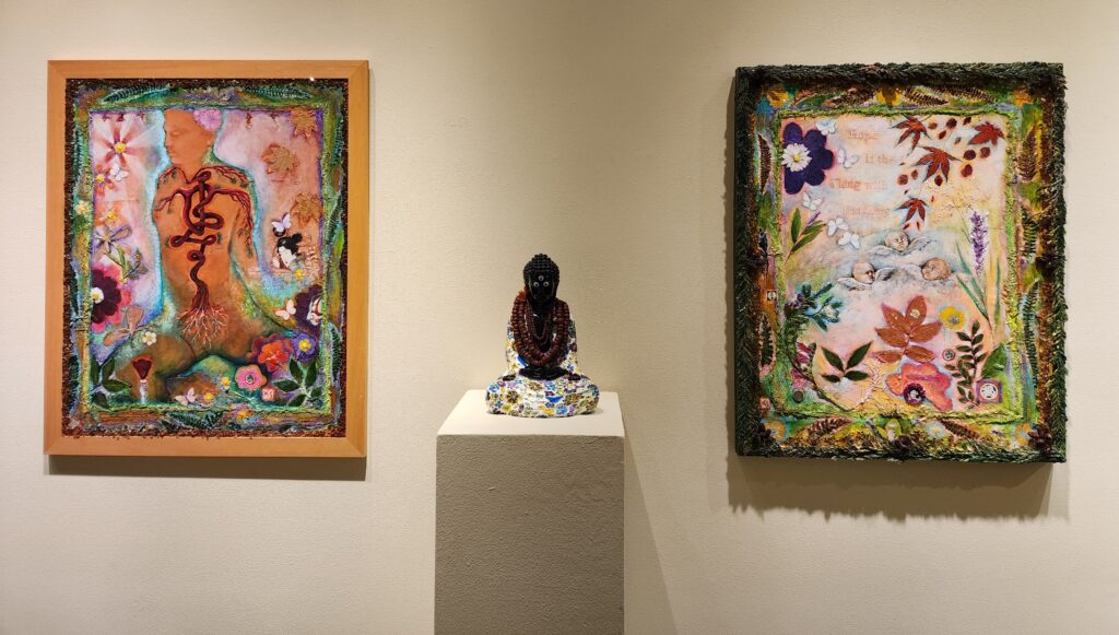 Kristin Shauck's mixed media paintings with Ryan Procheska's Groovy Buddha in the center.
