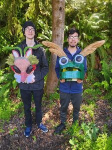 Spring term Basic Design students Noah Fukuda and Edrey Sedano holding masks created by Samantha Saldivar and Tanya Diaz Dolores.