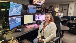 Bella Byers at her desk in the Astoria Police Department Dispatch room