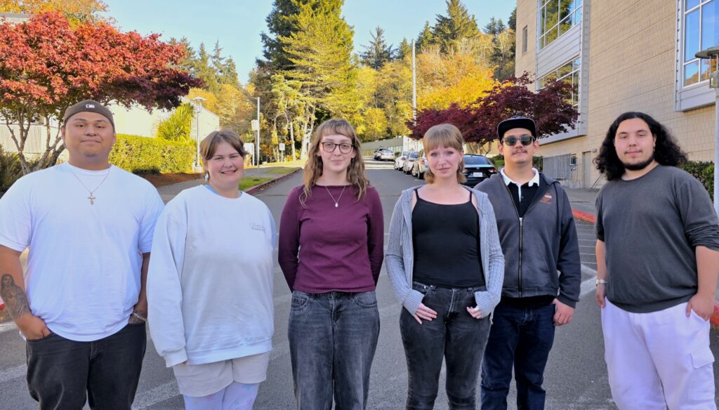 Members of student government stand on campus