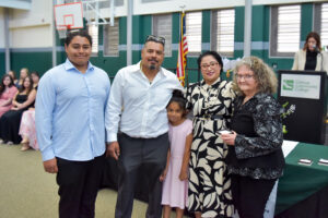 Argie Mendez-Alvarez poses with her family and mentor Eileen Purcell