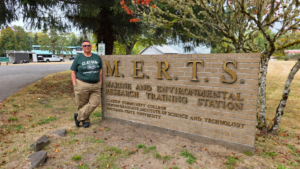 Beth Van Elswyk standing by the MERTS campus sign