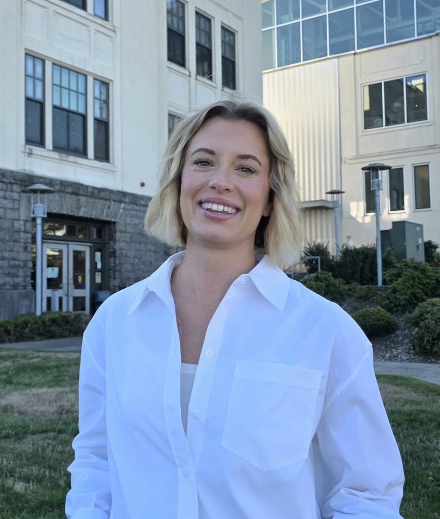 Briana Smith stands on the lawn of Clatsop Community College