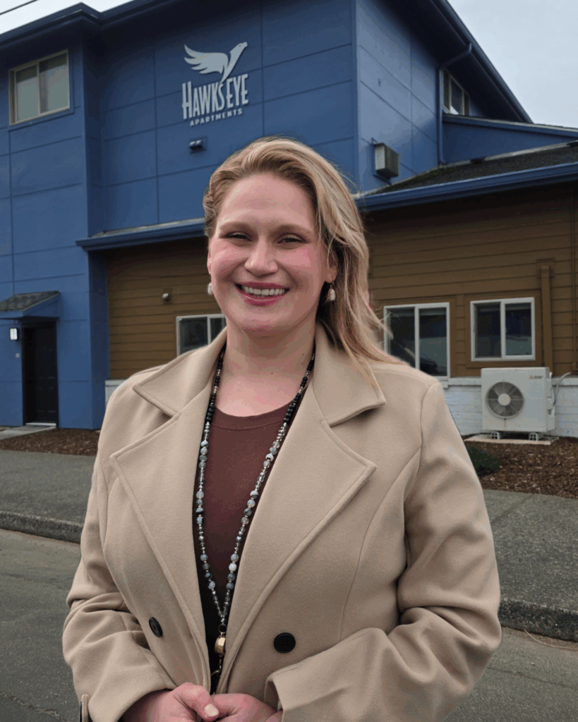Camille Leavitt stands outside the Hawks Eye facility where she now works