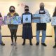 From left to right: CCC Painting students Jeff Donnelly, Allyson Preston, Arianna Nelson, Dick Magathan, and instructor Kristin Shauck showing off boxes by various participating CCC art students.
