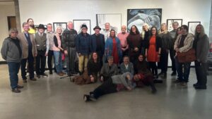 Artists gathered for a photo in the gallery