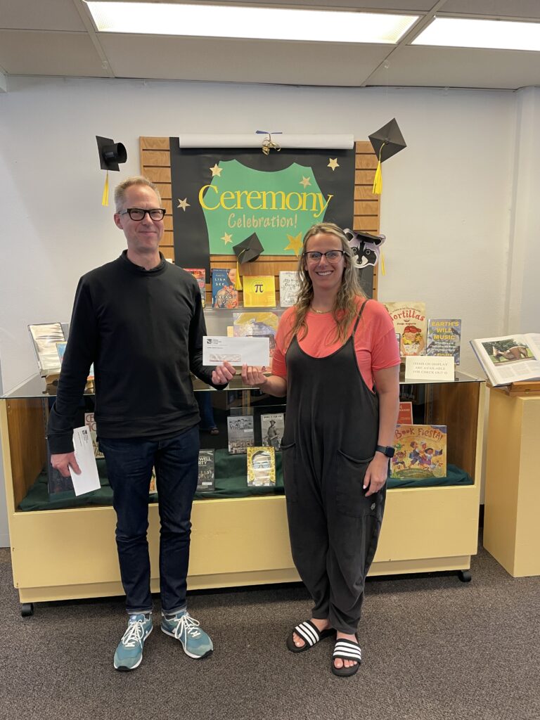 Lane Rehmke with Library Director Dan McClure