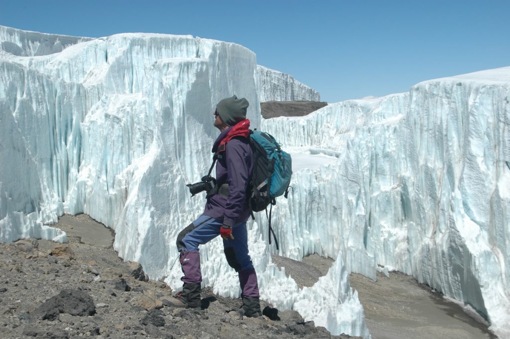 Peter G. Williams exploring the Northern Ice Field on the summit crater of Kilimanjaro, photo credit: Douglas Hardy