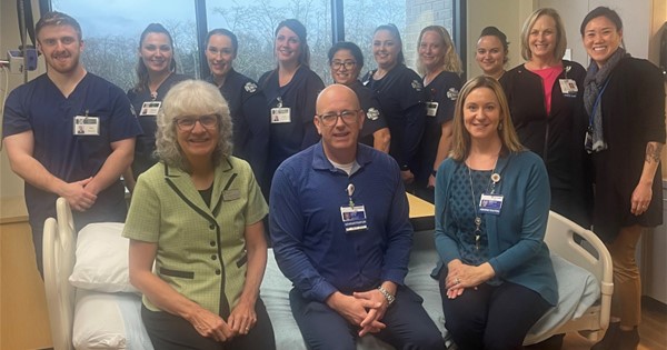 Providence Hospital staff pose with CCC students and donated beds