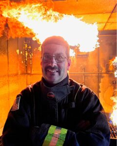 Wade Mathews in fire gear inside the college's burn facility