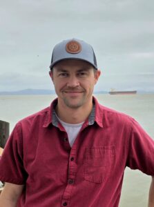 Kyle standing in front of the Columbia River