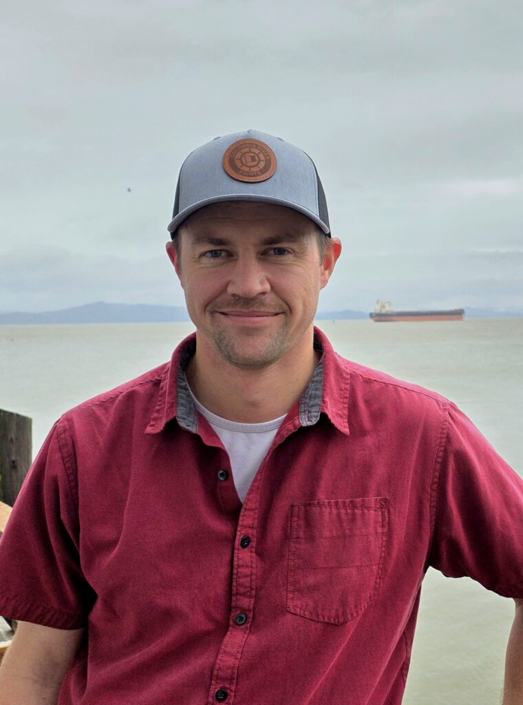 Kyle standing in front of the Columbia River