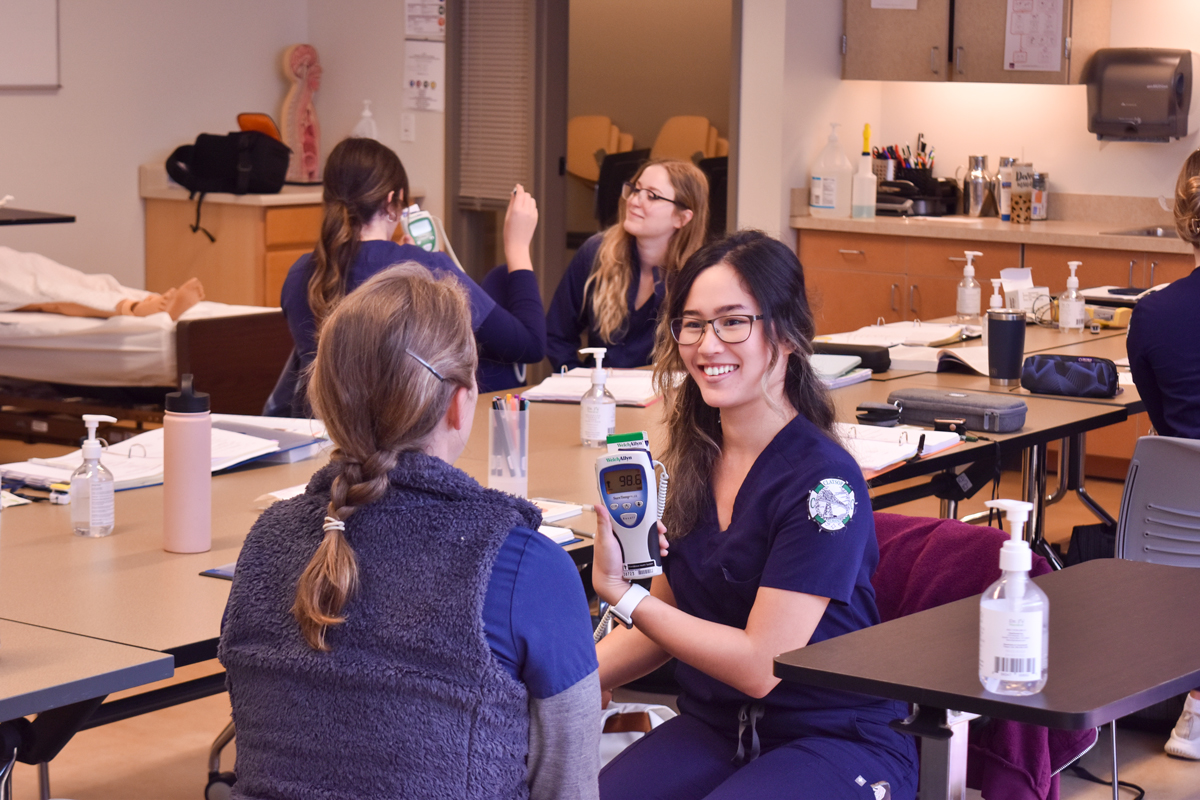 CCC Nursing students working in groups in a lab